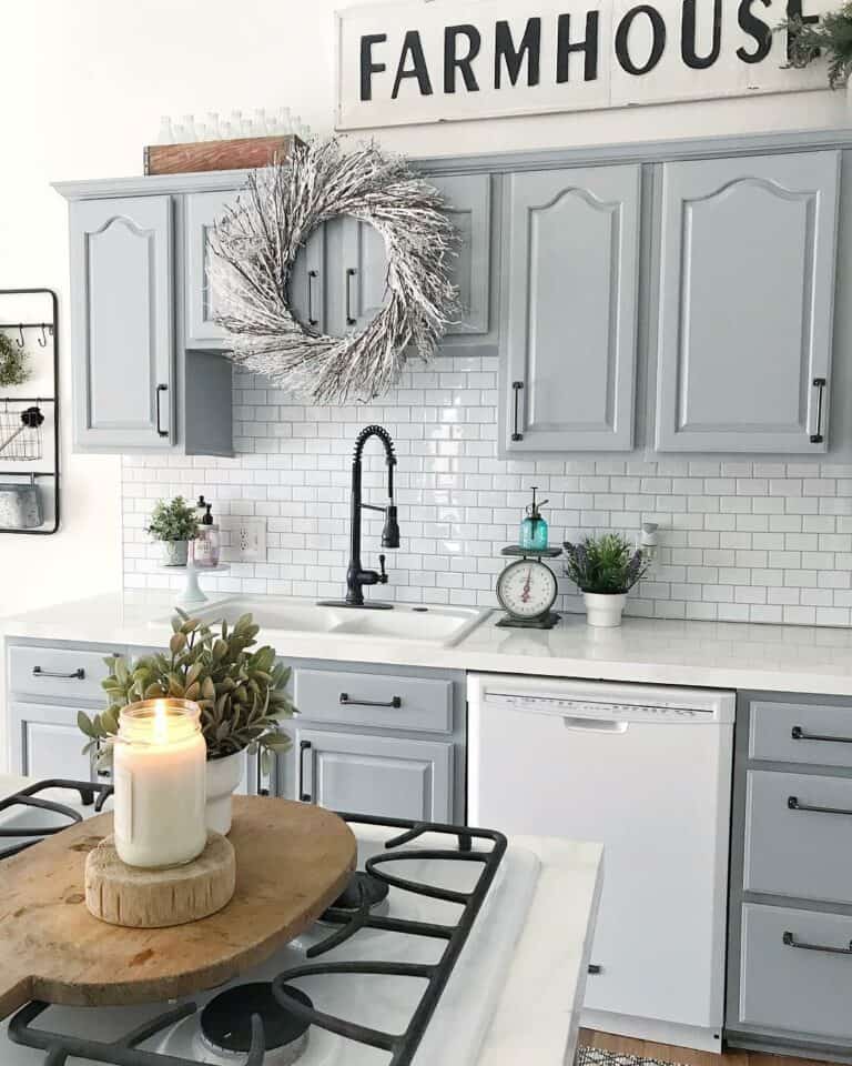 Grey Raised Panel Cabinets on a White Wall