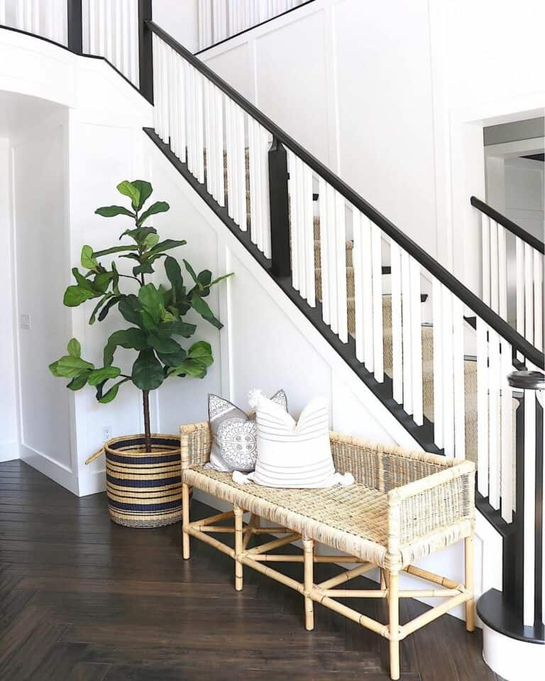 Herringbone Wood Floor Near a Black and White Staircase