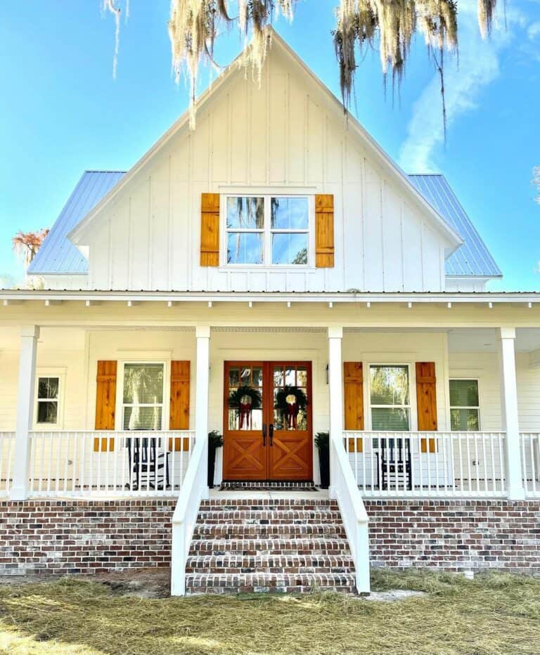 House with White Porch Railing and Brick Skirt