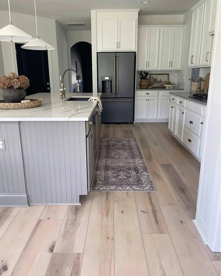 Light Gray Beadboard Cabinets and a White Countertop