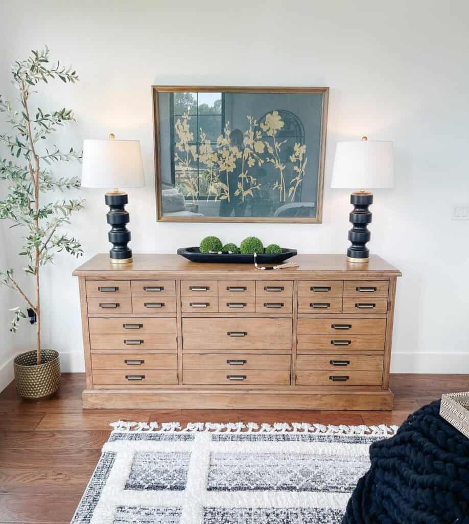Light Wood Dresser with Black Decorative Tray