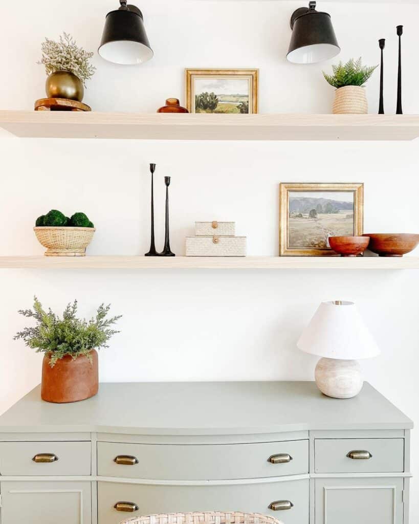 Light Wood Floating Shelves Above Grey Dresser