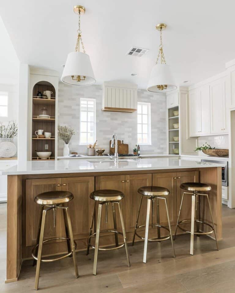 Muted Tones With Shiny Brass Bar Stools