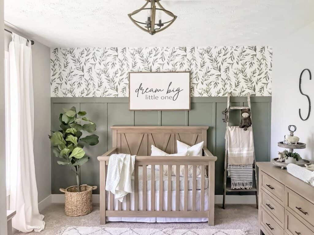 Nursery with Herbal Wallpaper and Green Half-Wall Wood Paneling