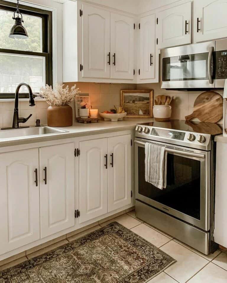 Ornate White Cabinets with Black Hardware