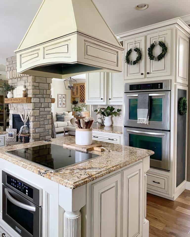 Ornate White Raised Panel Doors With Black Knobs