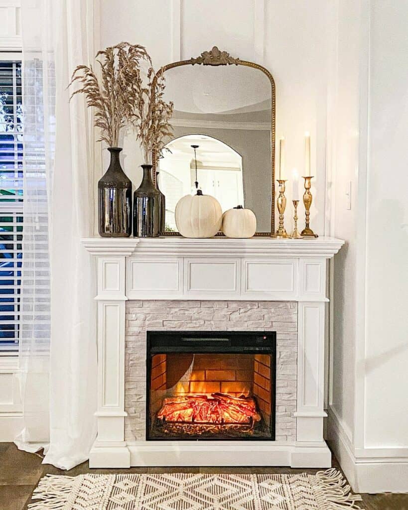Paired Mantel Décor in Front of Large Mirror