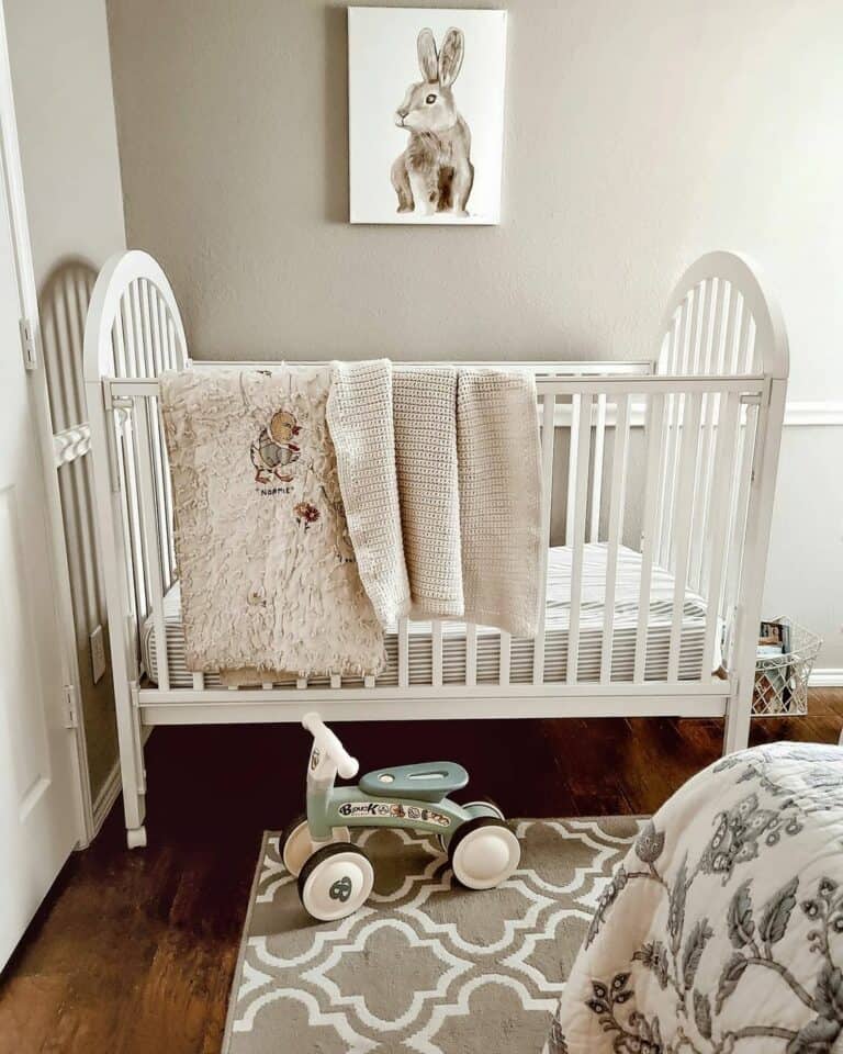 Rabbit on a Light GrAy Nursery Wall With a White Chair Rail Trim