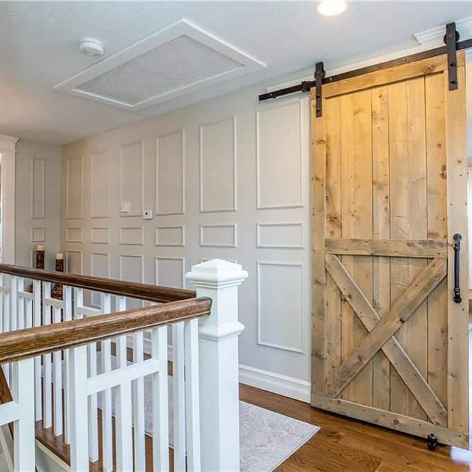 Recessed Lighting in Hallway with Wood Barn Door