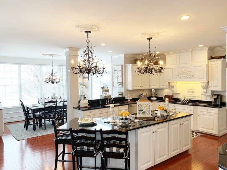 Spacious Kitchen With Dark Wood Chairs