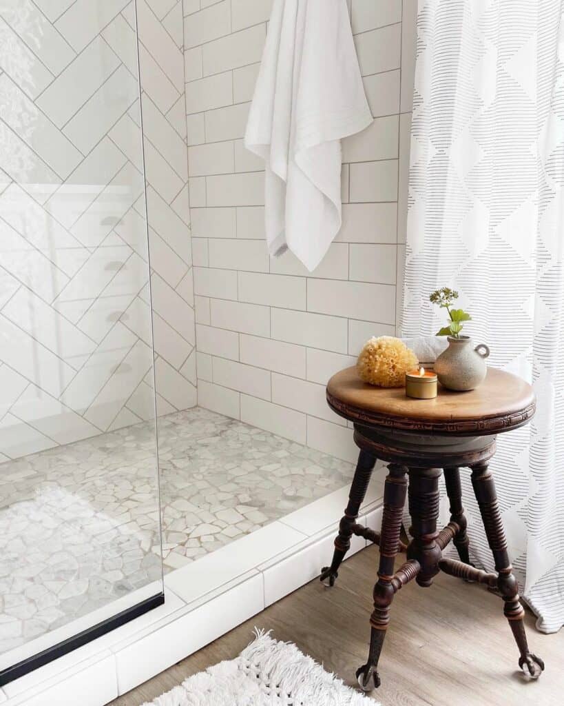 Stone Shower Floor with White Tile Curb