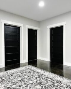 Three Black Doors with White Trim