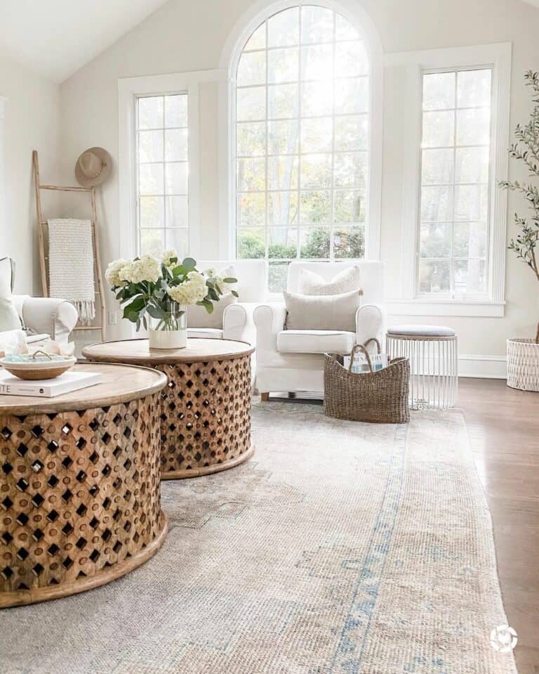 Two Round Coffee Tables in Well-Lit Room