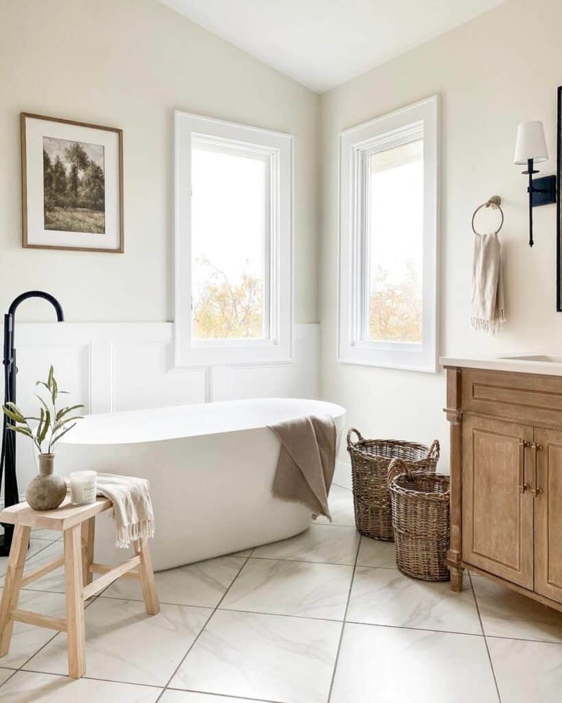 Two Windows on a Bathroom Wall With White Wainscoting