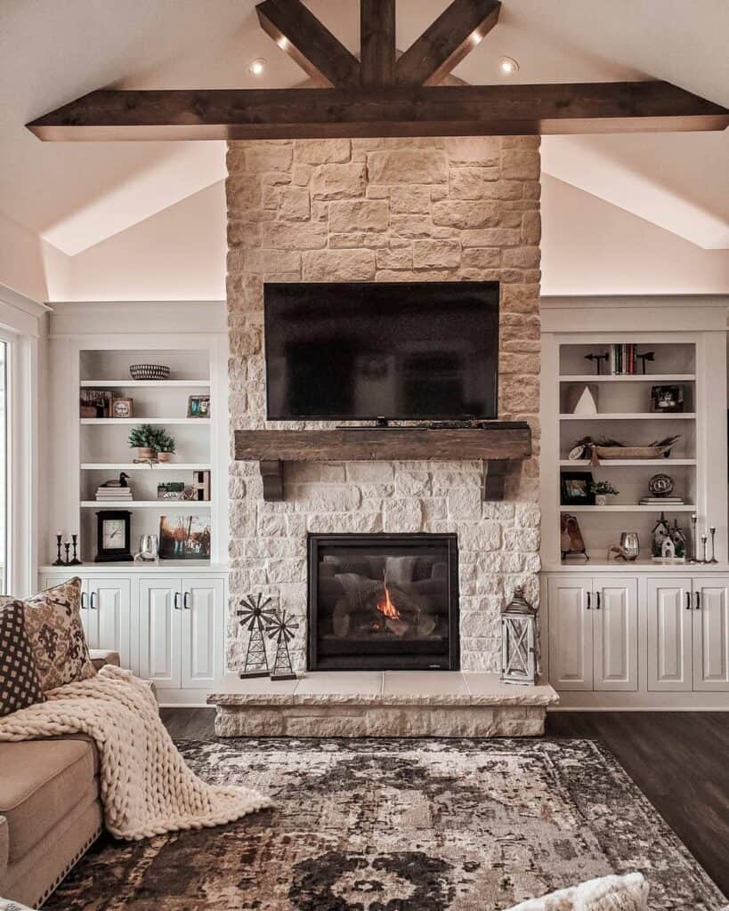 Vaulted Ceiling Living Room with Dark Wood Beam and Matching Mantel