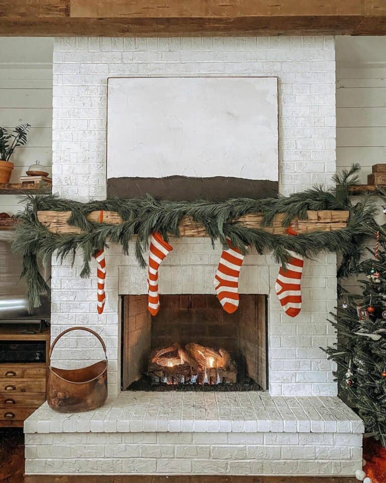 White Brick Fireplace With Candy-Striped Stockings