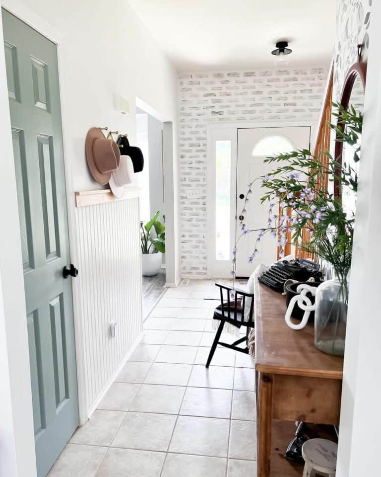 White Brick Wall and Beadboard Paneling Entryway