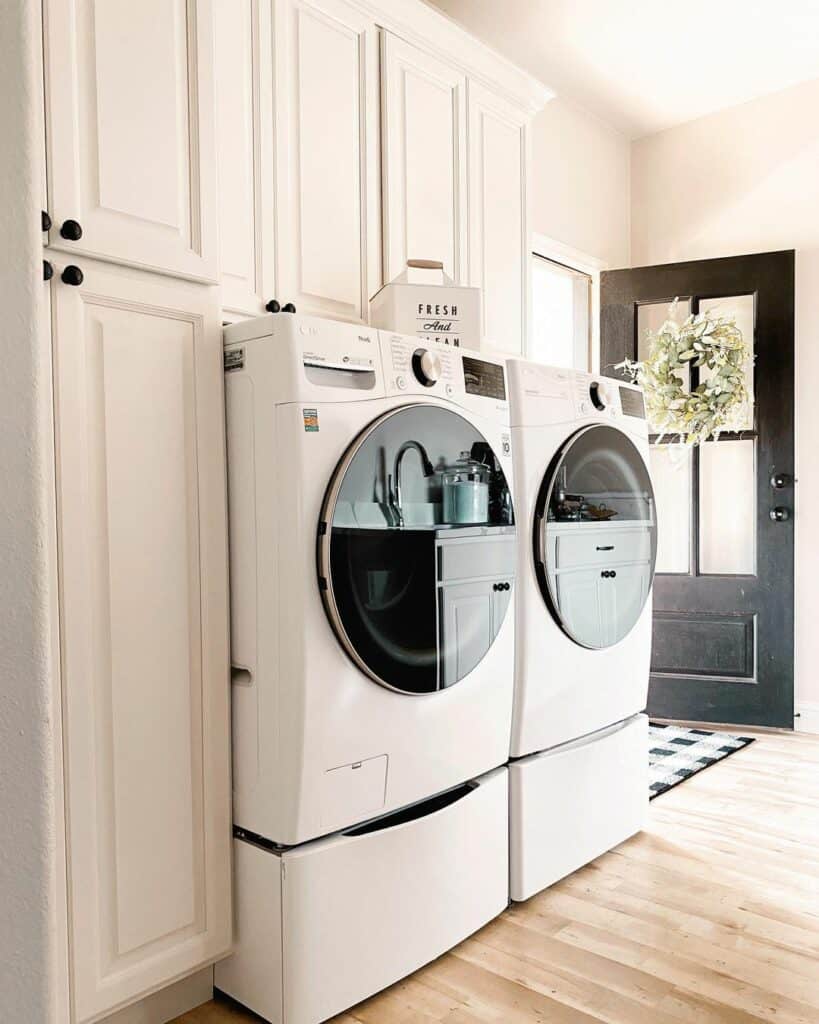 White Cabinets With Black Knobs and Raised Panels