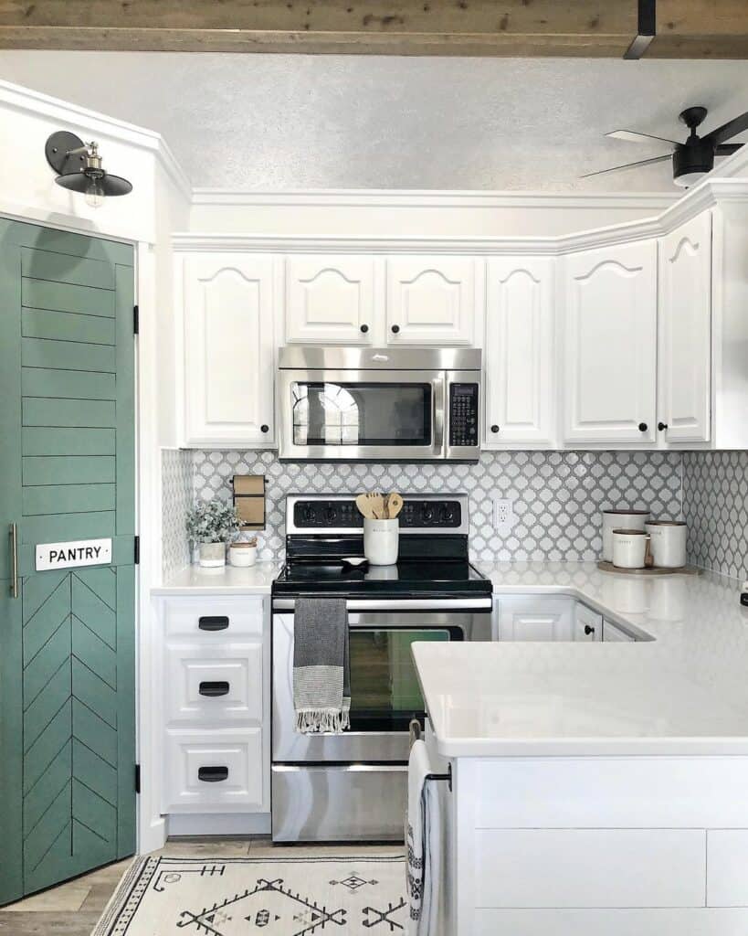 White Cabinets and a Green Pantry Door