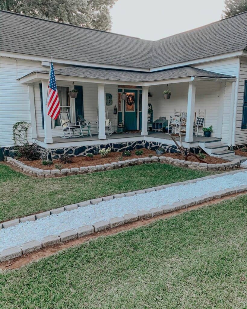 White Covered Porch with Gray Shingle Roof