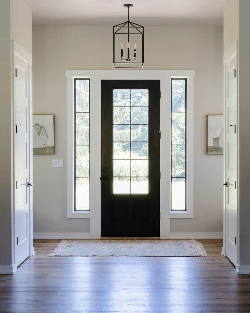 White Entryway with Black Door and Entryway Chandelier