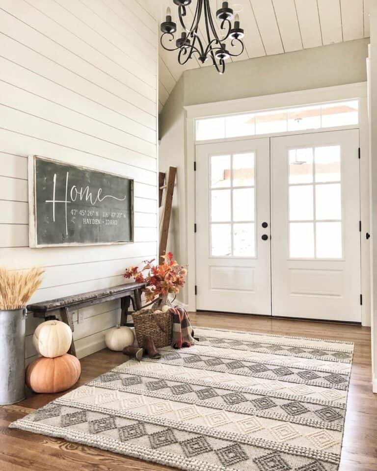 White Entryway with Black and Pumpkin Décor