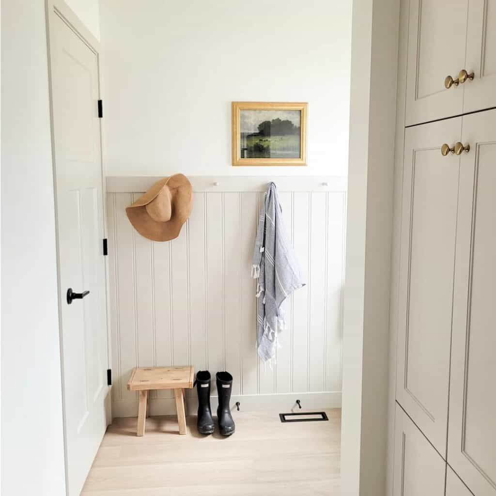 White Mudroom Wall with White Wainscoting
