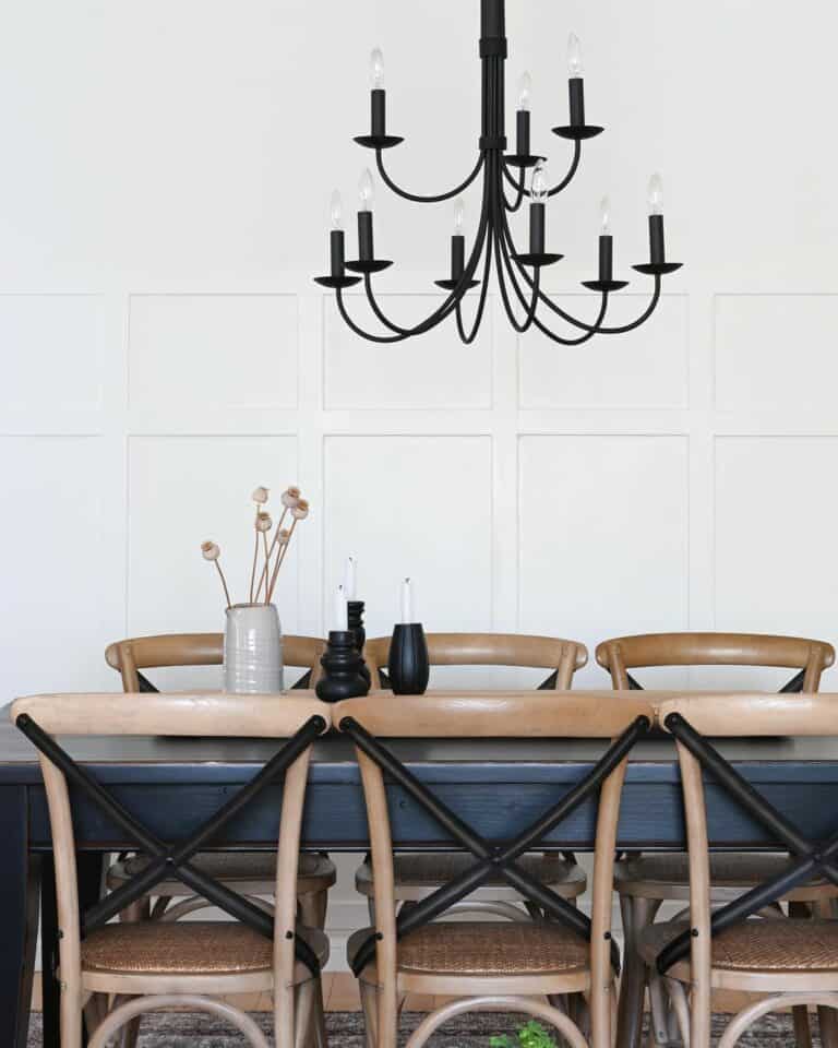White Paneled Walls and a Black Candelabra Chandelier