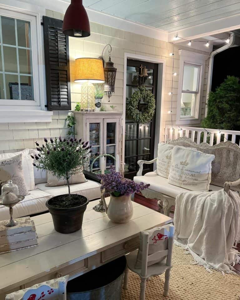 White Porch Railing with String Lights