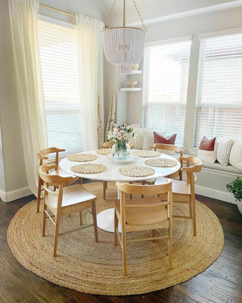 White Round Dining Room Table on Jute Rug