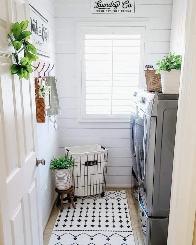 White Shiplap Laundry Room with Greenery