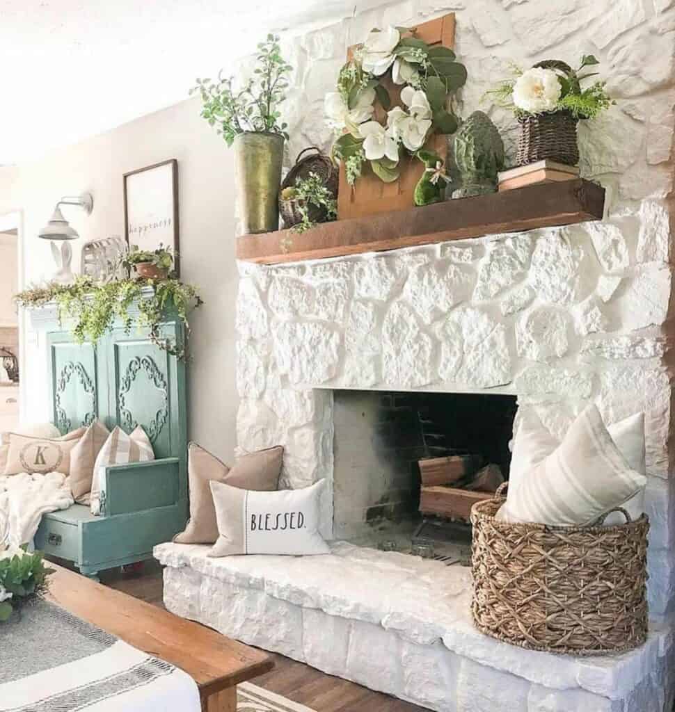 White Stone Fireplace with Greenery