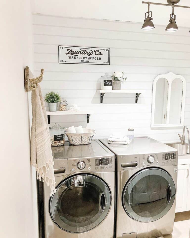 White and Black Shelves on White Shiplap Accent Wall