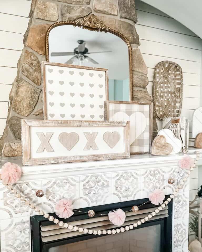 White and Gray Tile Fireplace with Pink Garland