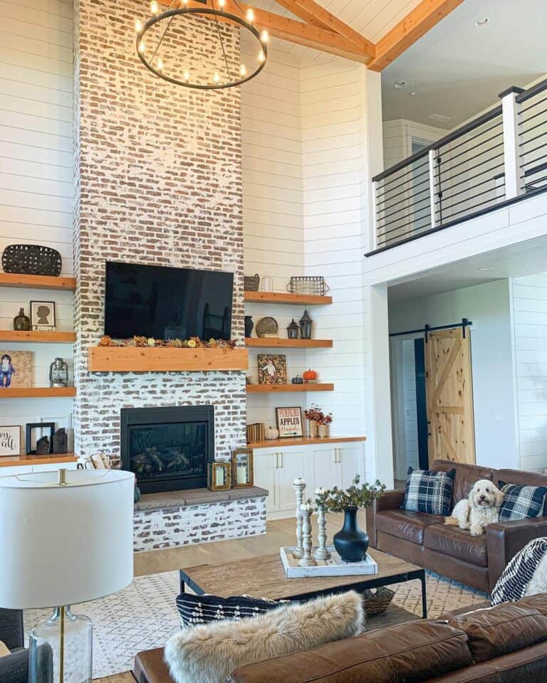 Whitewashed Brick Fireplace with Vaulted Ceilings