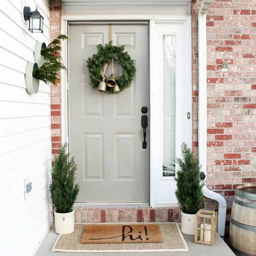 Winter Door Decorations on Brick Exterior