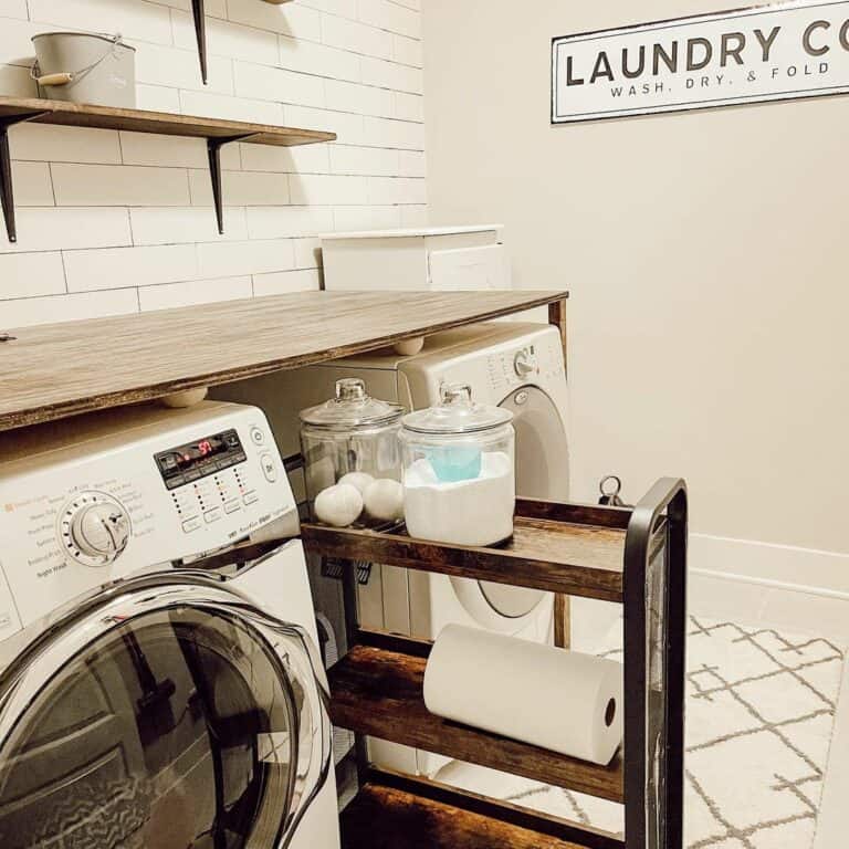 Wood Accents in White Tile Laundry Room Wall