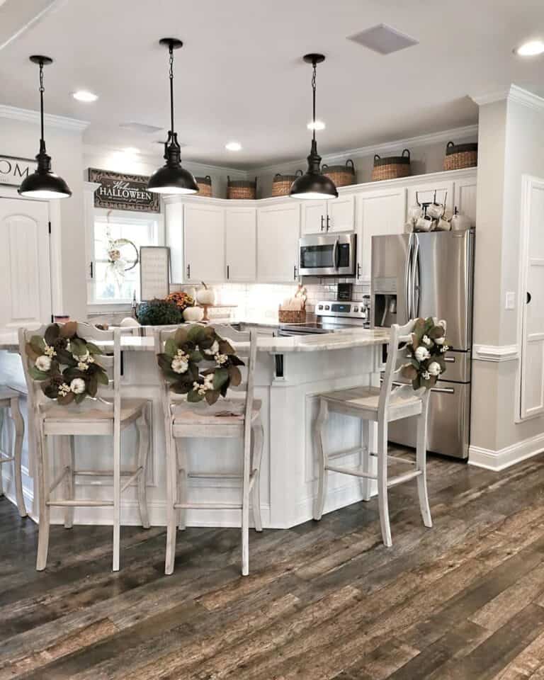 Wreath-Adorned Chairs Around Cozy Kitchen Island