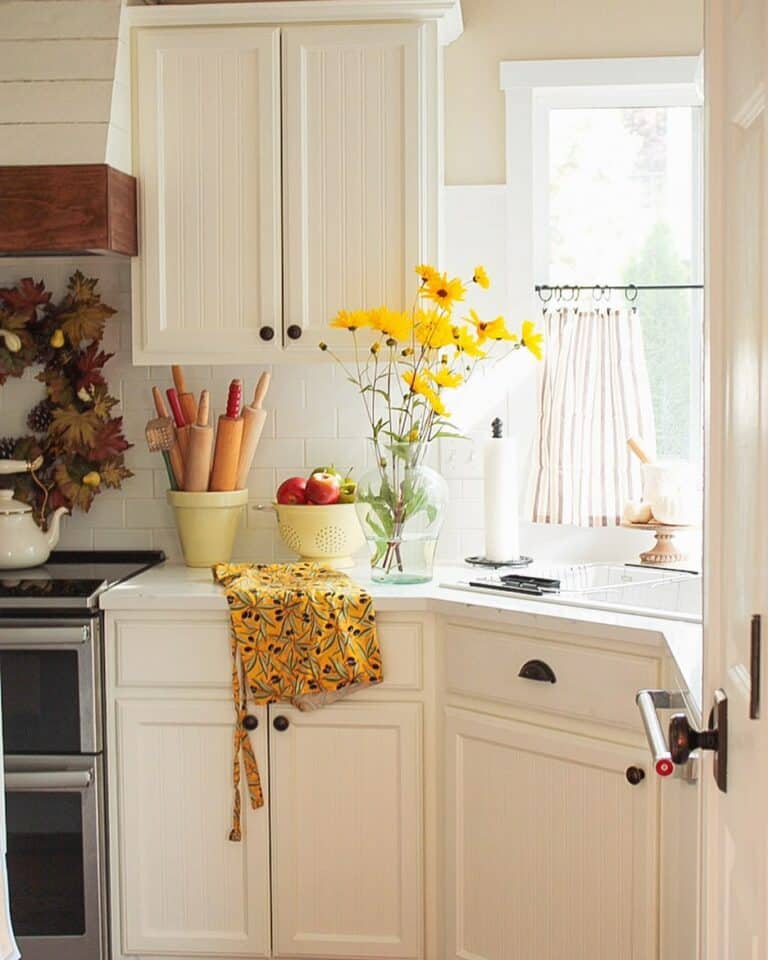 Yellow Flowers and White Beadboard Cabinets