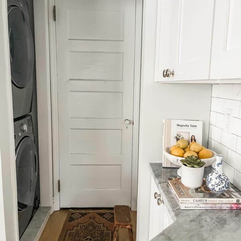 Yellow Lemons Against a White Subway Tile Backsplash