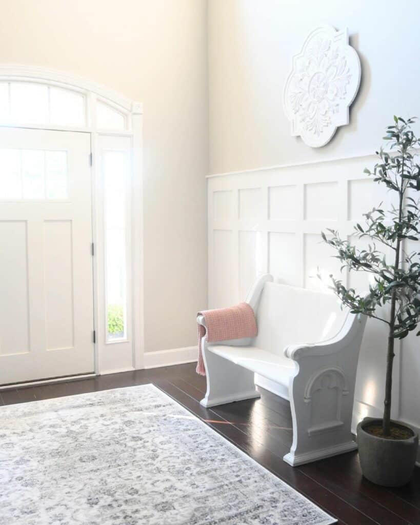 All-white Entryway With Persian Rug