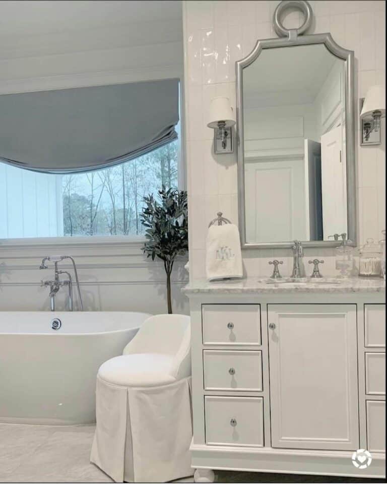 Bathroom With White Slipcovered Chair
