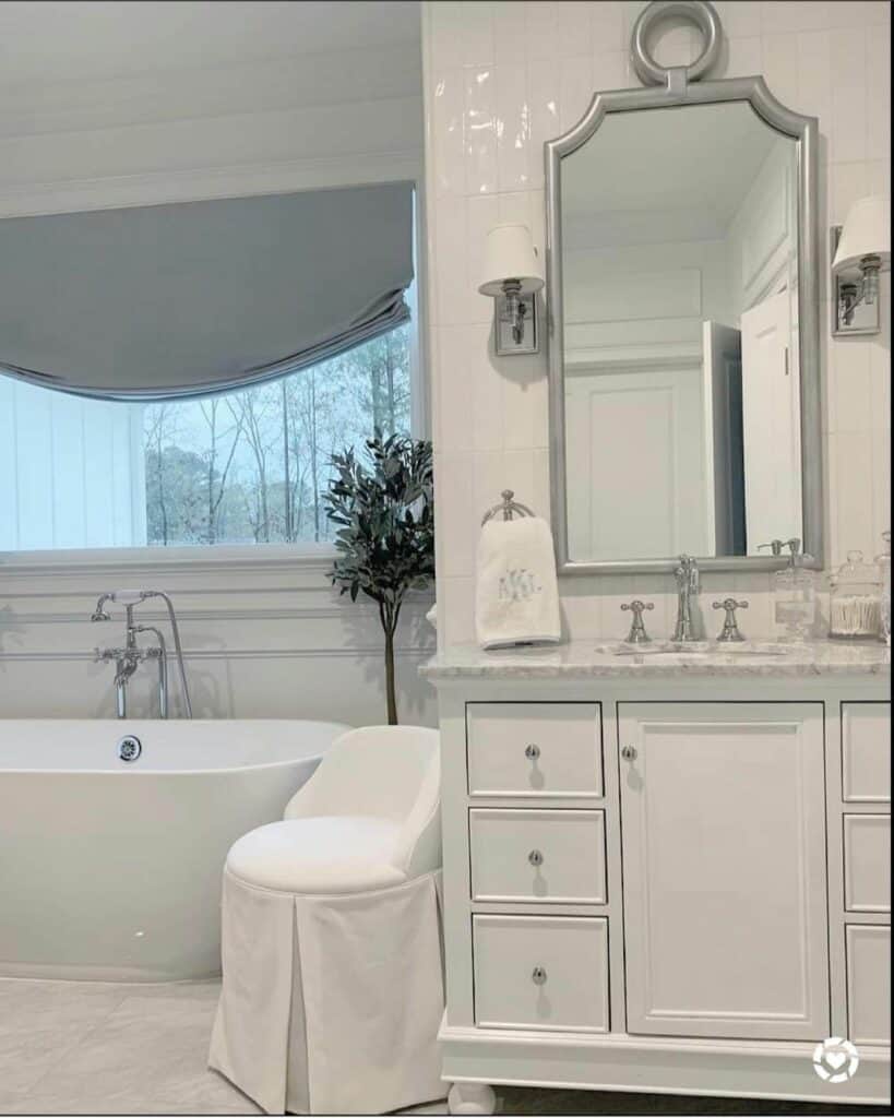 Bathroom With White Slipcovered Chair