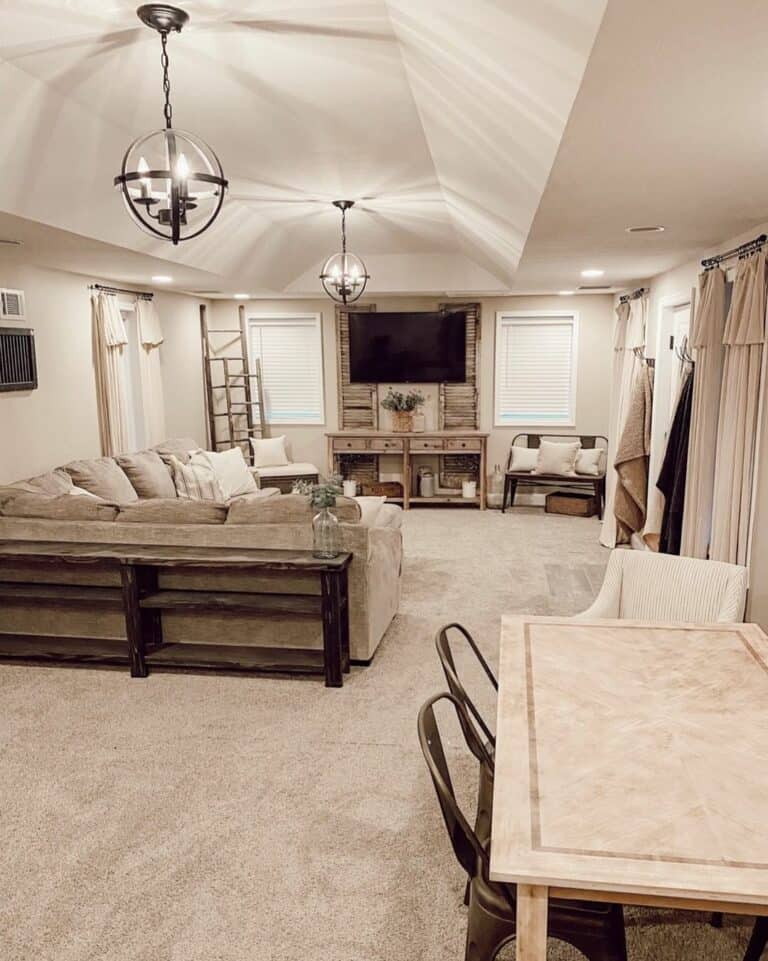 Beige Living Room With Vaulted Ceiling and Globe Lighting