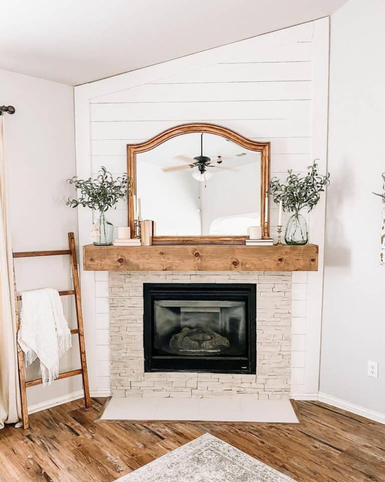 Beige Stone Corner Fireplace With Wood Ladder