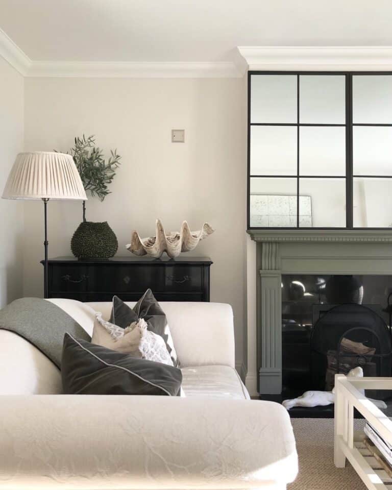 Beige and Black Living Room With Large Mirror