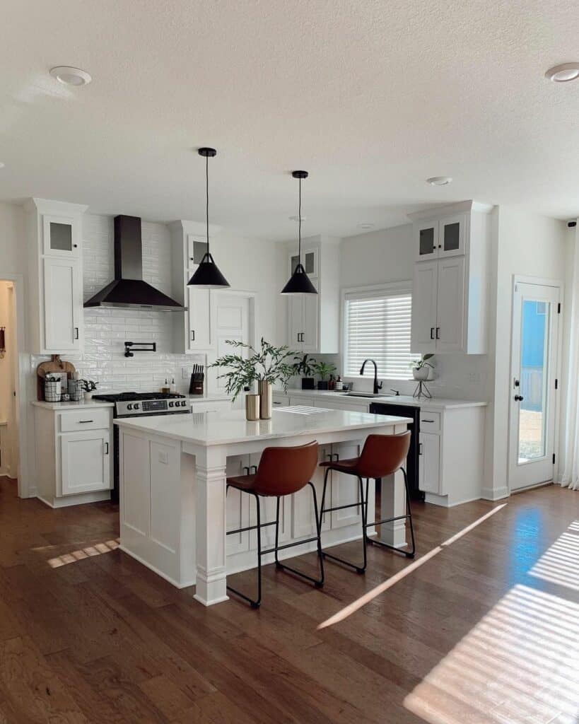 Black Accent Pendants in White Kitchen