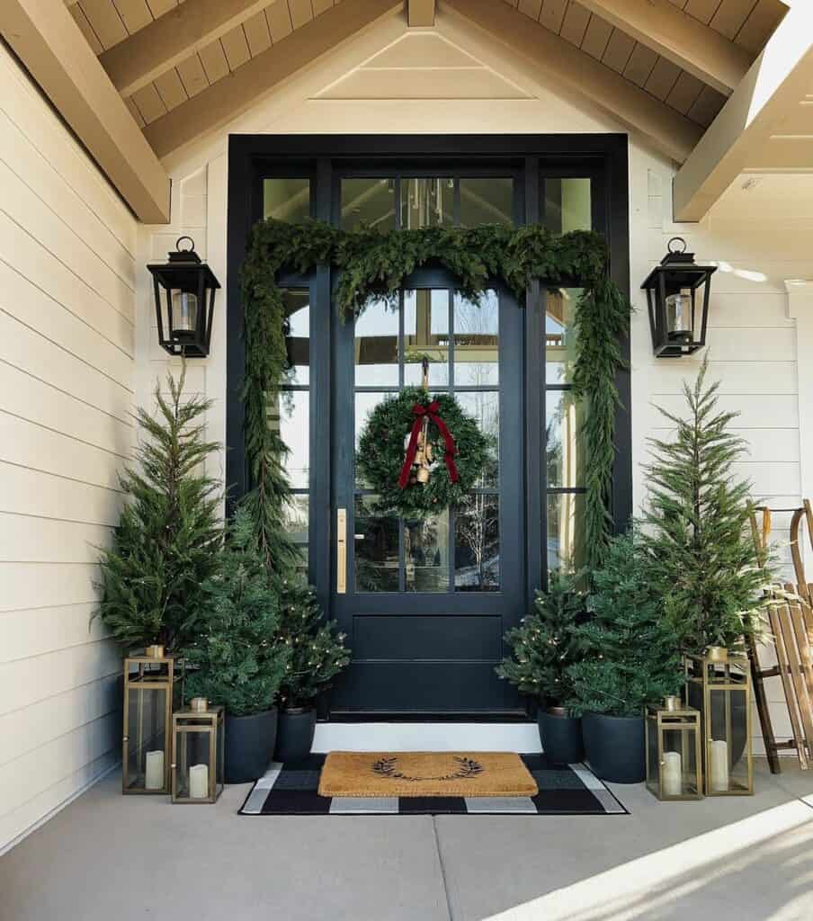 Black Door with Holiday Garland on Modern Front Porch