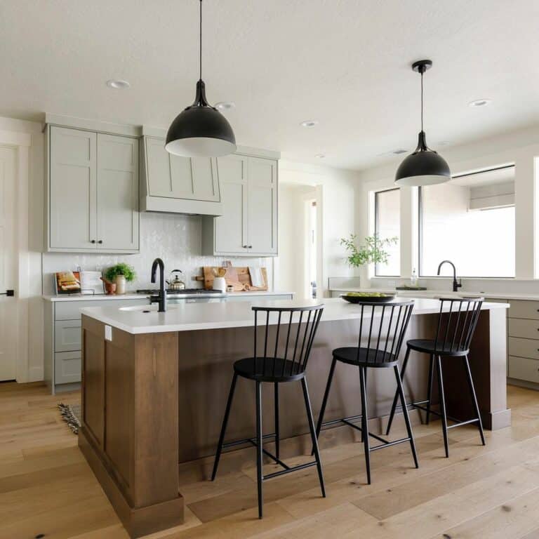 Black Farmhouse Pendant Lighting Over Wood Island