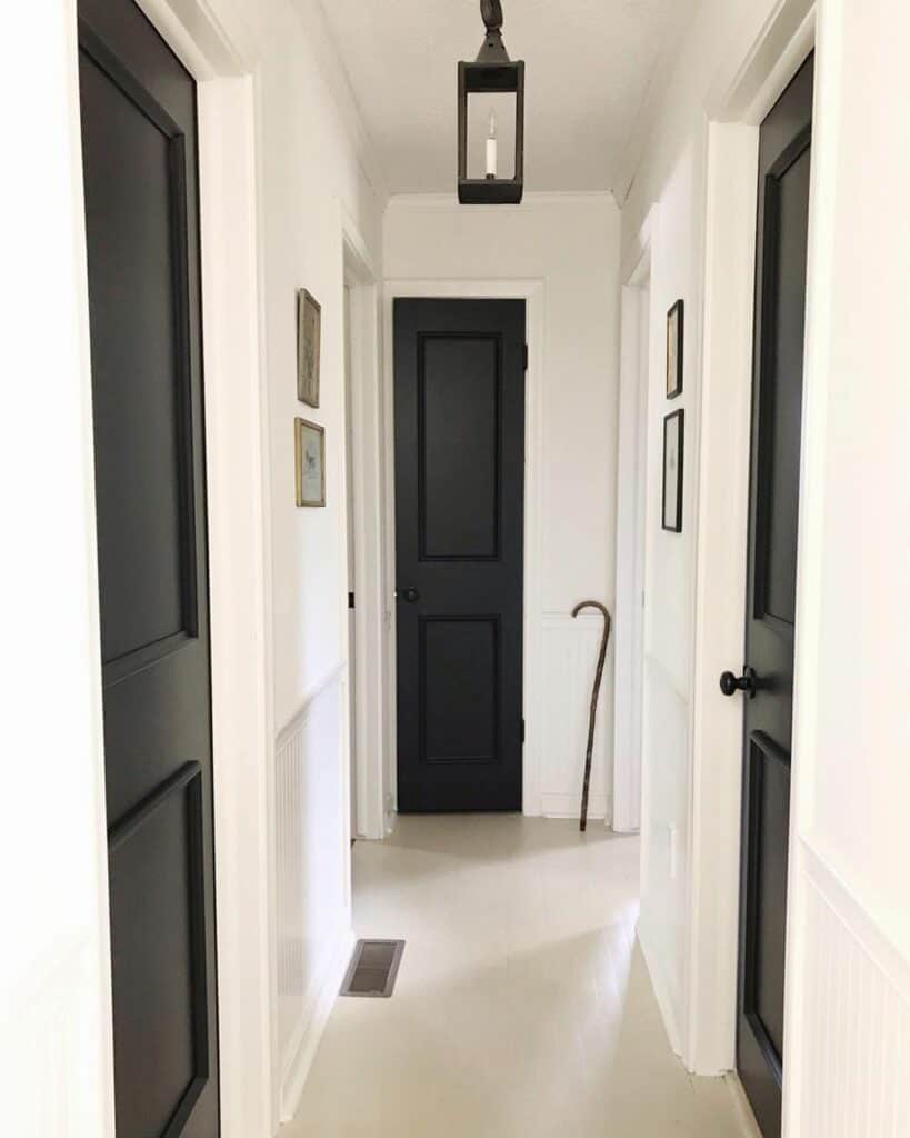 Black Hallway Doors Contrast With White Walls Soul & Lane